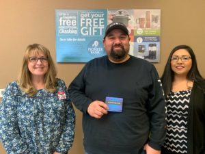 Ericka Laney and Brandi Candelaria present Rodolfo with his $500 gift card.